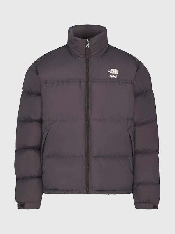 The North Face x Skims 1996 Nuptse Jacket Jacket unisex detail view 2 | Dash Racegear — Limited edition The North Face × SKIMS Brown 1996 Nuptse Jacket featuring bold oversized puffer design for fashion-forward winter looks.