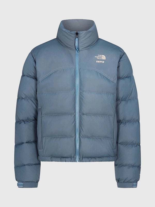 The North Face x Skims 2000 Nuptse Jacket Jacket unisex front product view | Dash Racegear — The North Face × SKIMS 2000 Nuptse Blue Puffer Jacket with glossy finish and insulation, for women, ideal winter city wear.