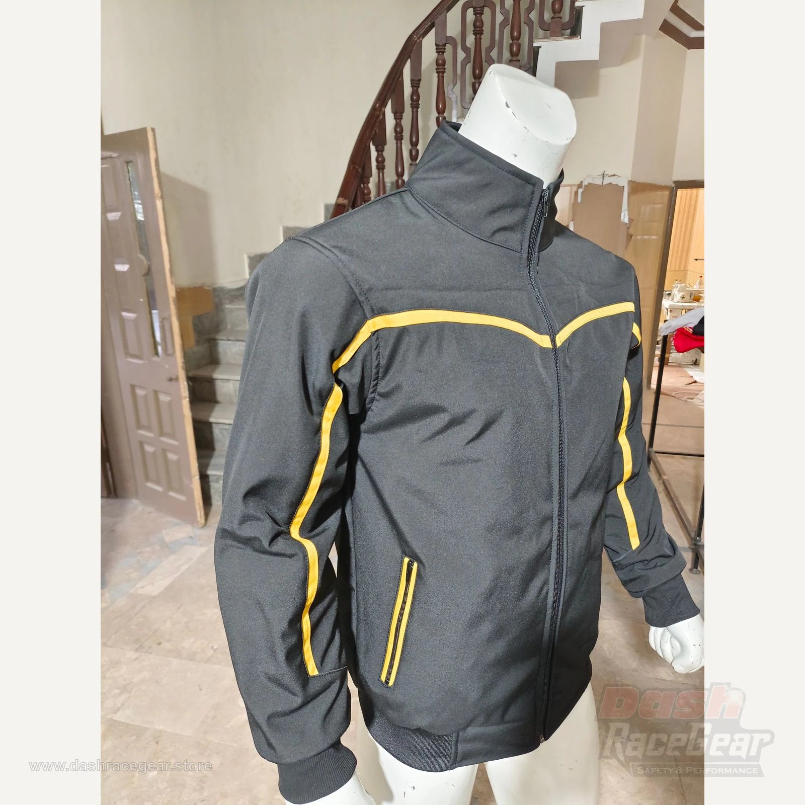 Apex black and yellow quilted softshell jacket angled front view by Dash Racegear