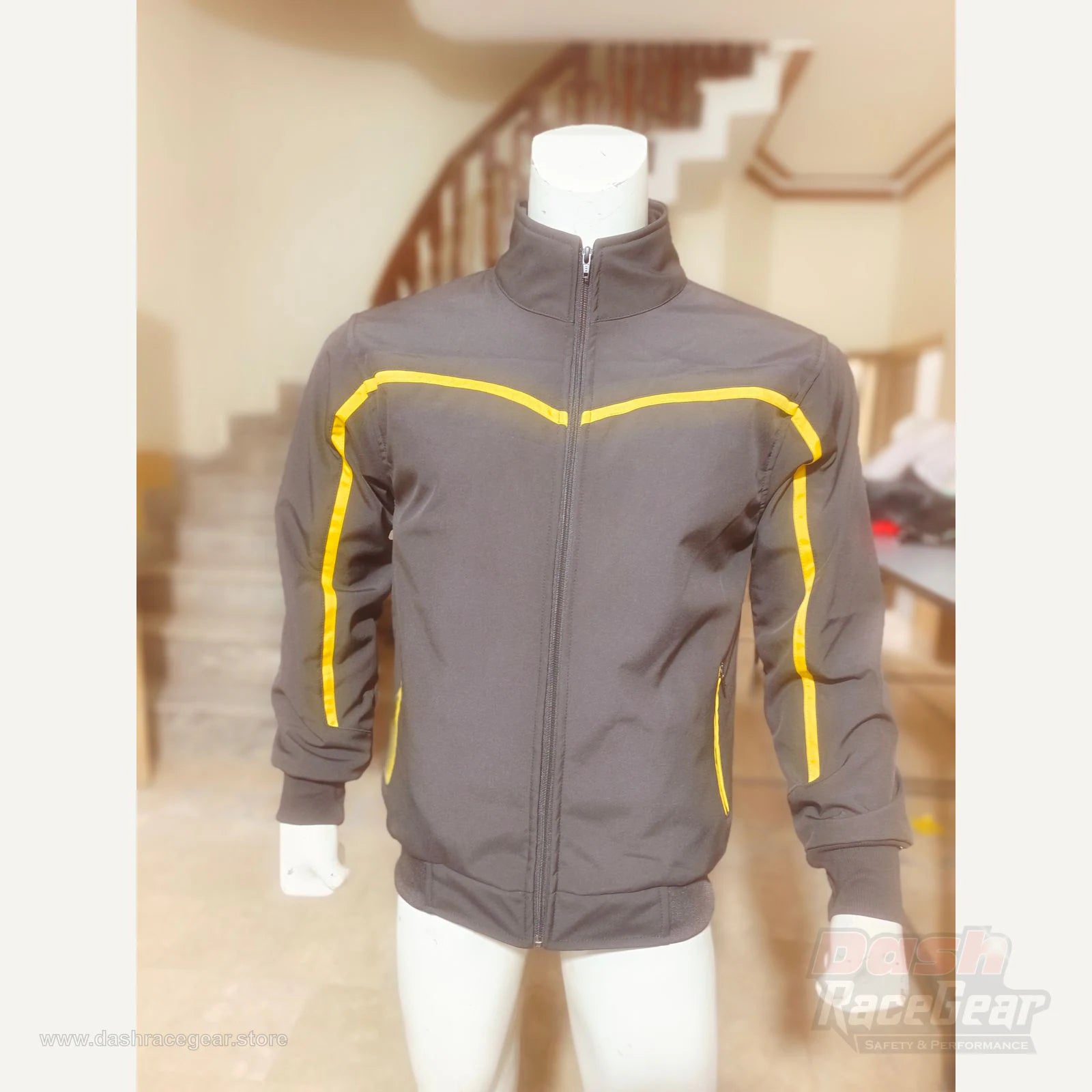 Apex black and yellow quilted softshell jacket hero front view by Dash Racegear