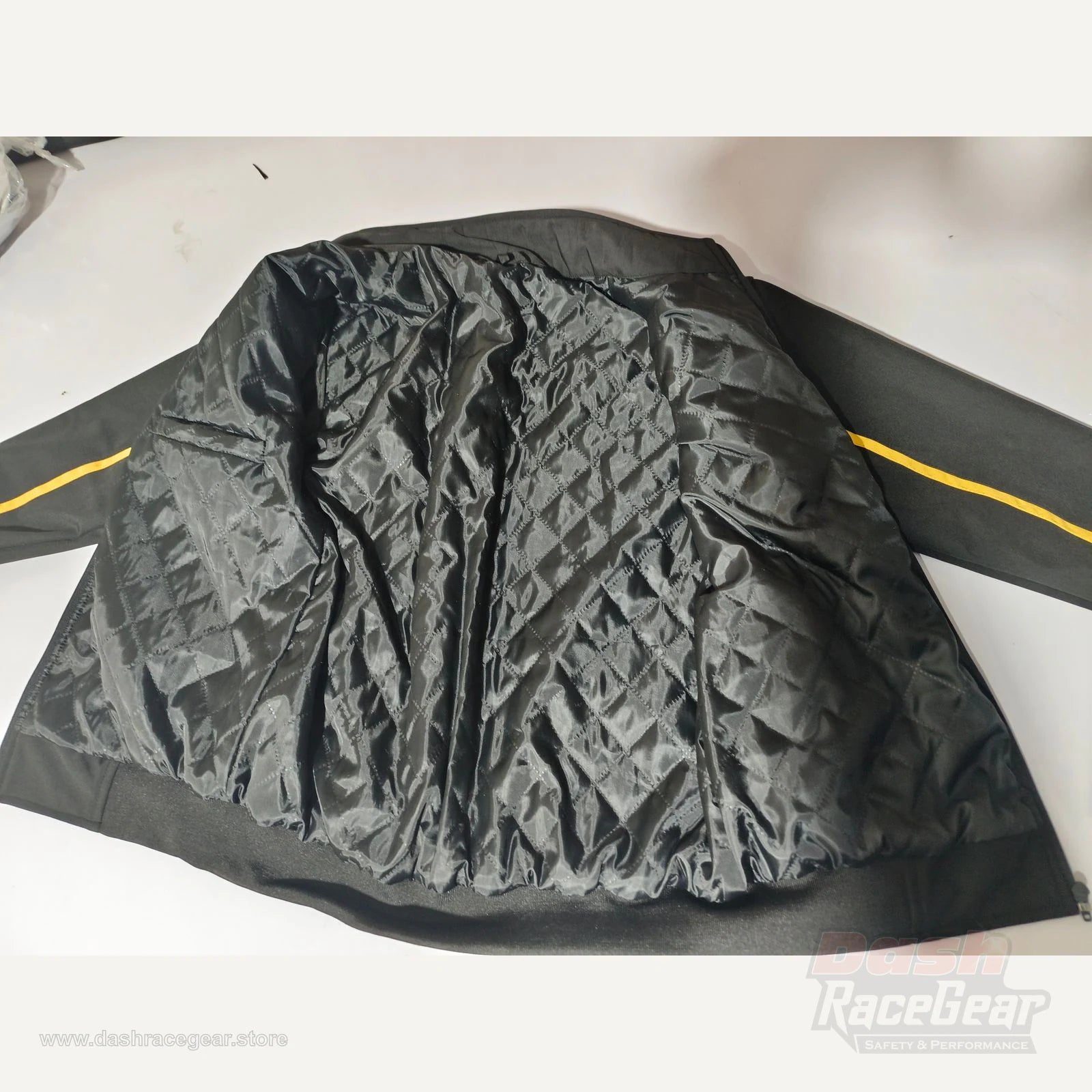 Apex softshell jacket open interior showing black diamond quilted lining