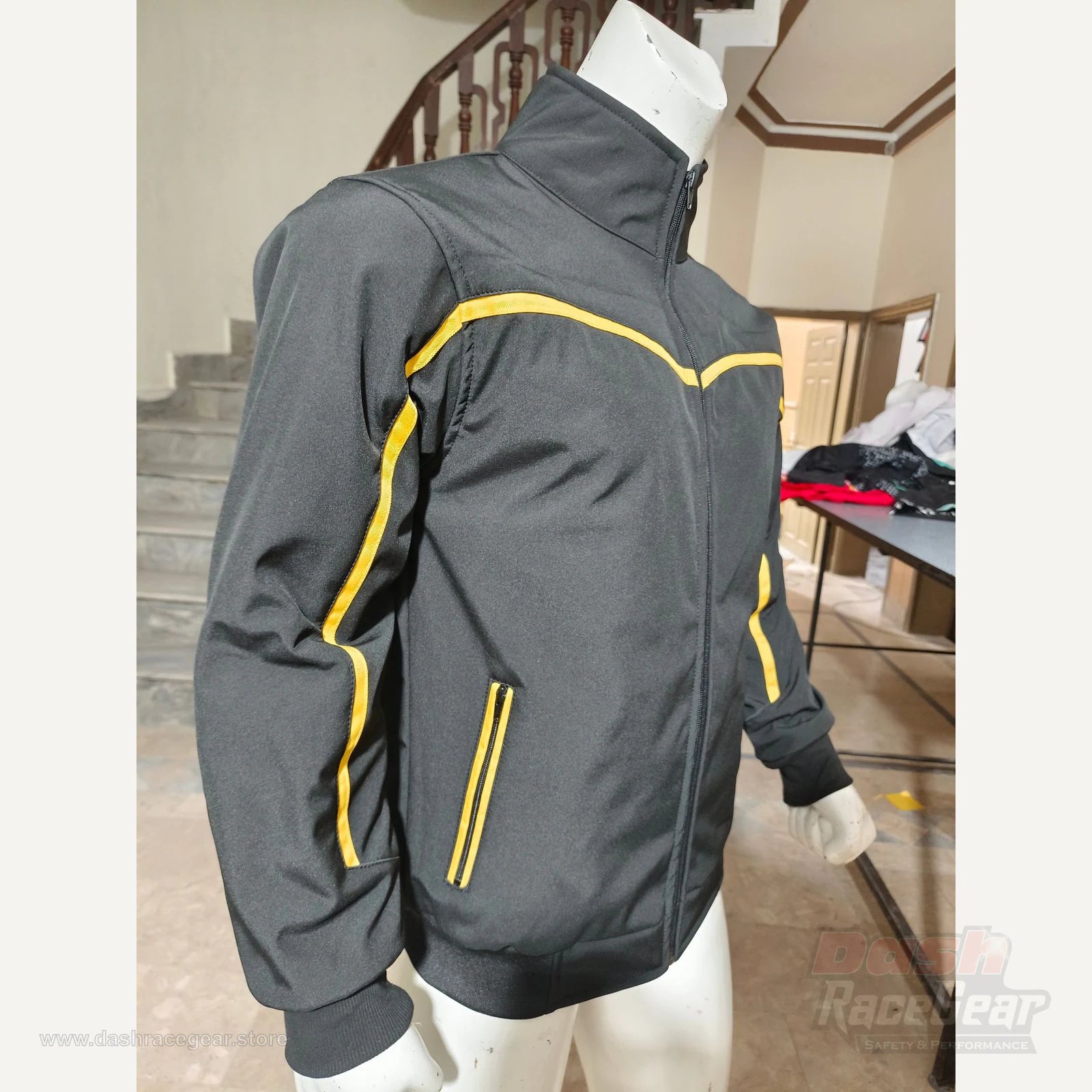 Apex black and yellow quilted softshell jacket side angle and zip pocket detail