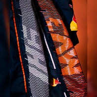 2026 Zandvoort race suit orange and white fabric detail by DASH RACEGEAR