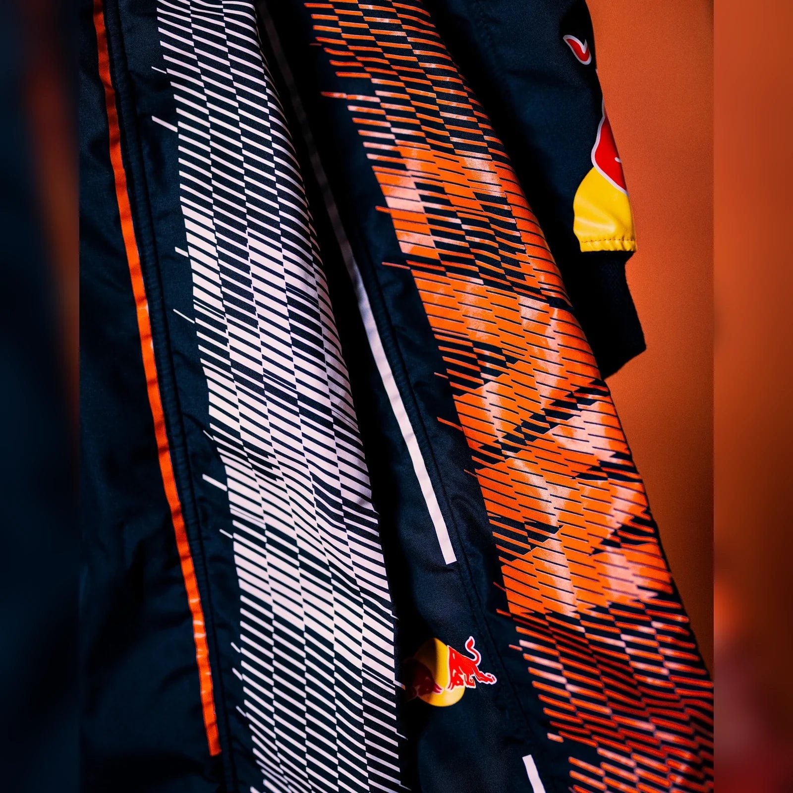 2026 Zandvoort race suit orange and white fabric detail by DASH RACEGEAR