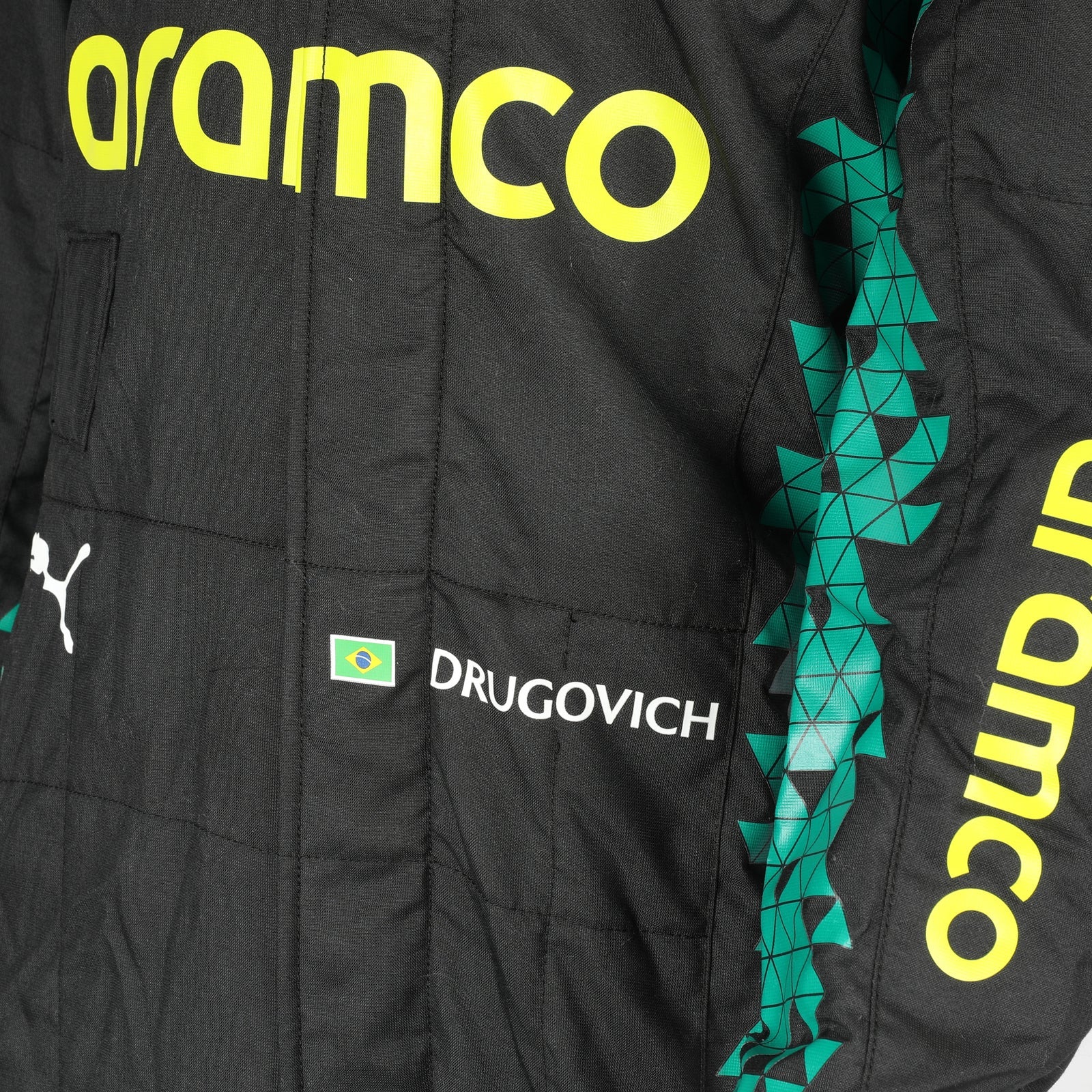  FIA and Puma collar label on Felipe Drugovich’s 2025 Aston Martin F1 race suit – Dash Racegear.
