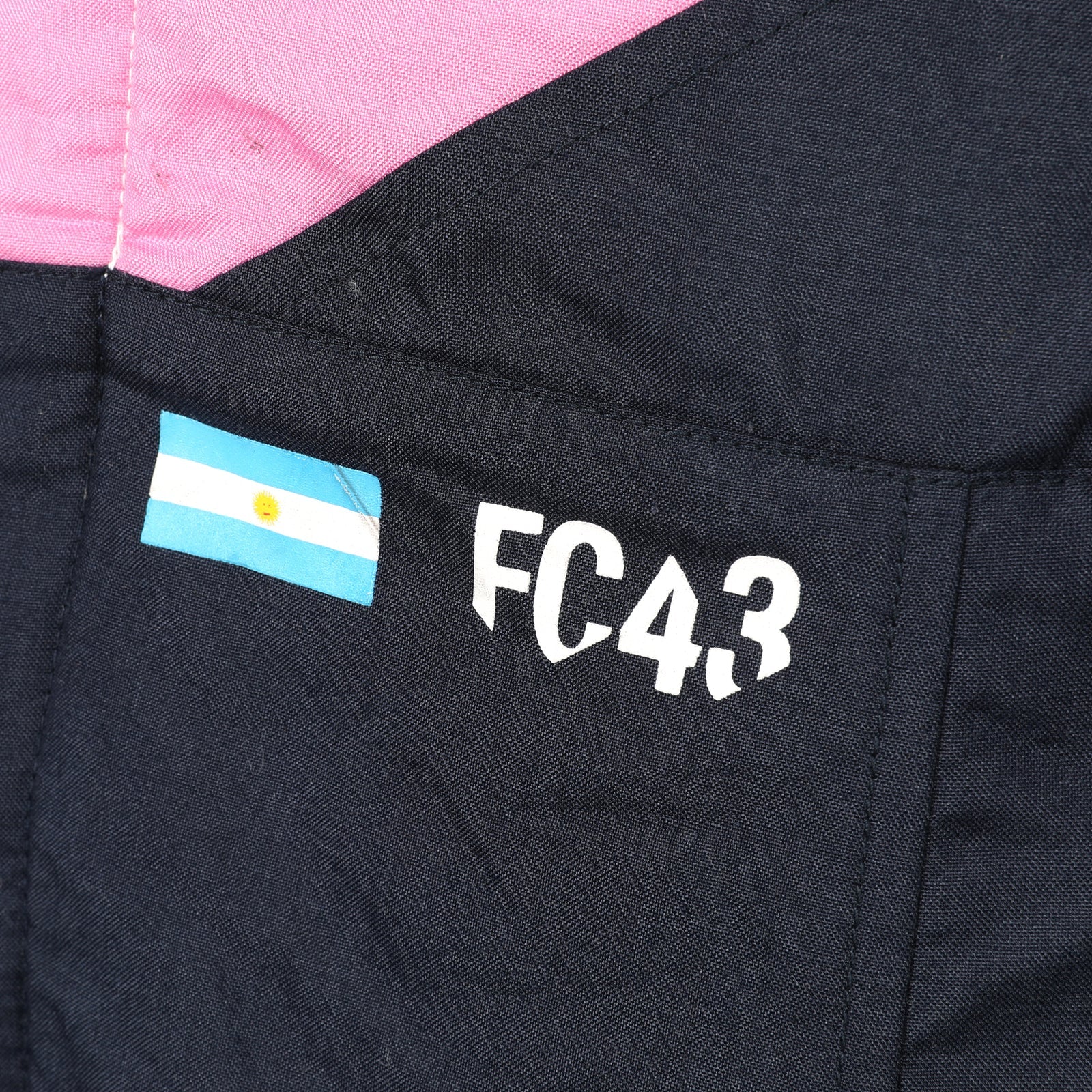 Franco Colapinto FC43 and Argentina flag detail on the 2026 Alpine F1 race suit – Dash Racegear.