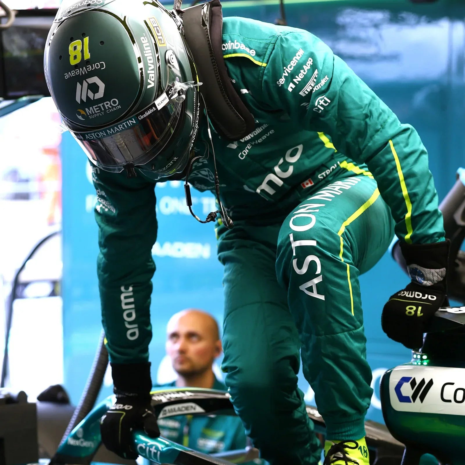 NexGen and sponsor logos on Lance Stroll’s green 2025 F1 race suit sleeve – Dash Racegear.