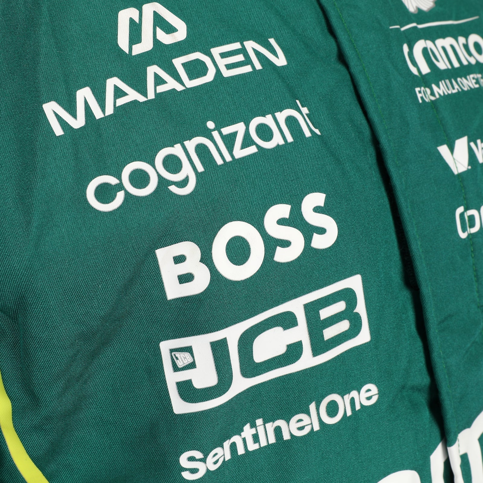  Puma, Pirelli and sleeve sponsor details on Lance Stroll’s 2025 F1 race suit – Dash Racegear.