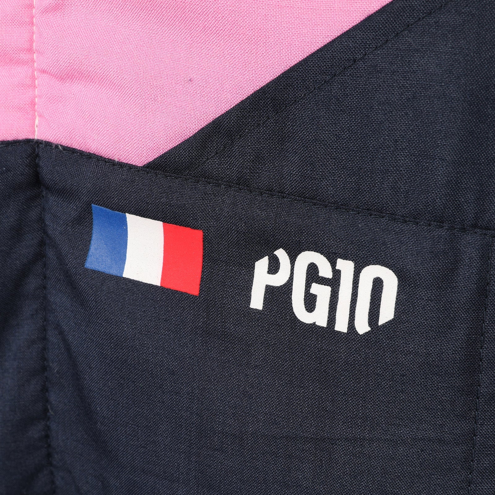 Pierre Gasly PG10 and French flag detail on the 2026 Alpine F1 race suit – Dash Racegear.