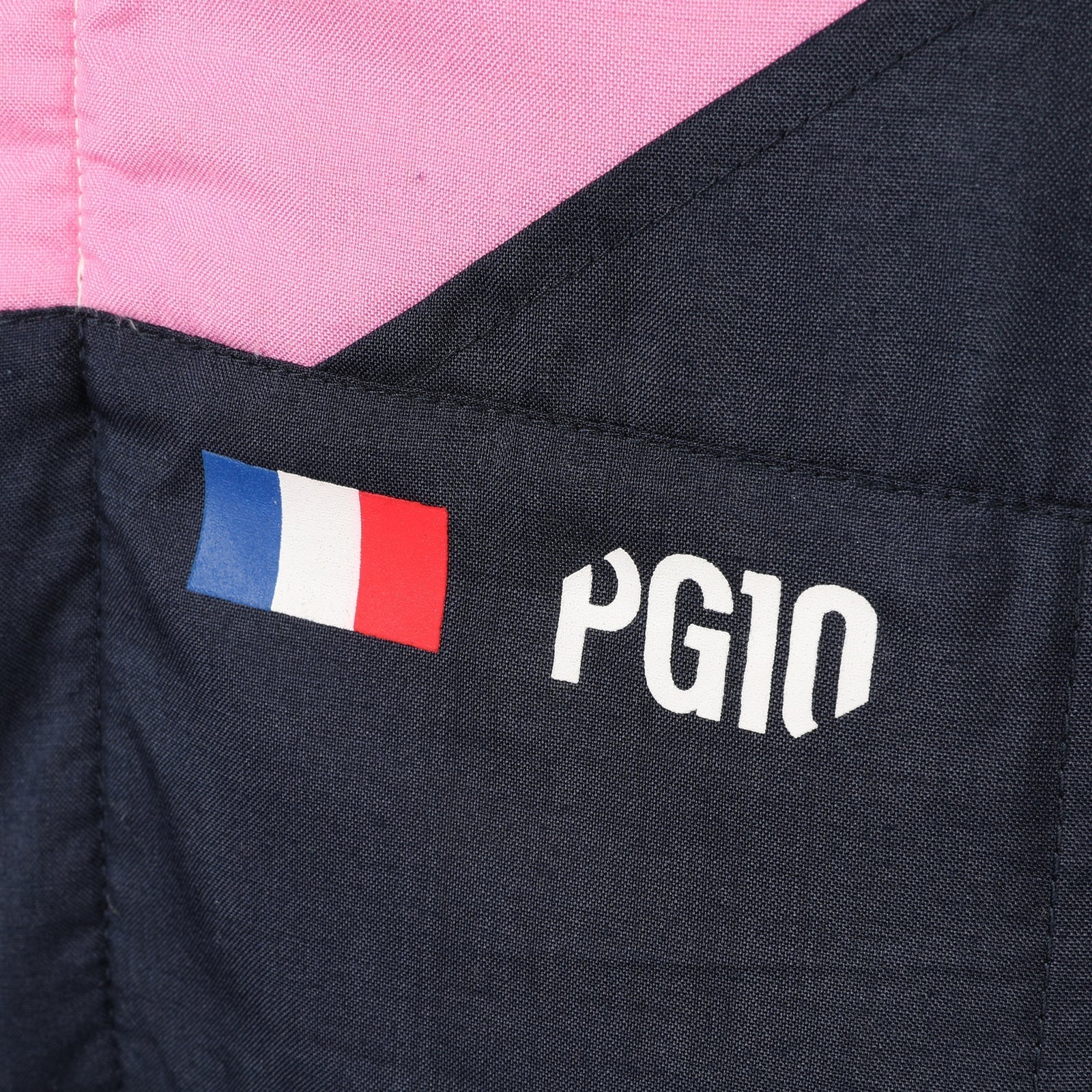 Pierre Gasly PG10 and French flag detail on the 2026 Alpine F1 race suit – Dash Racegear.