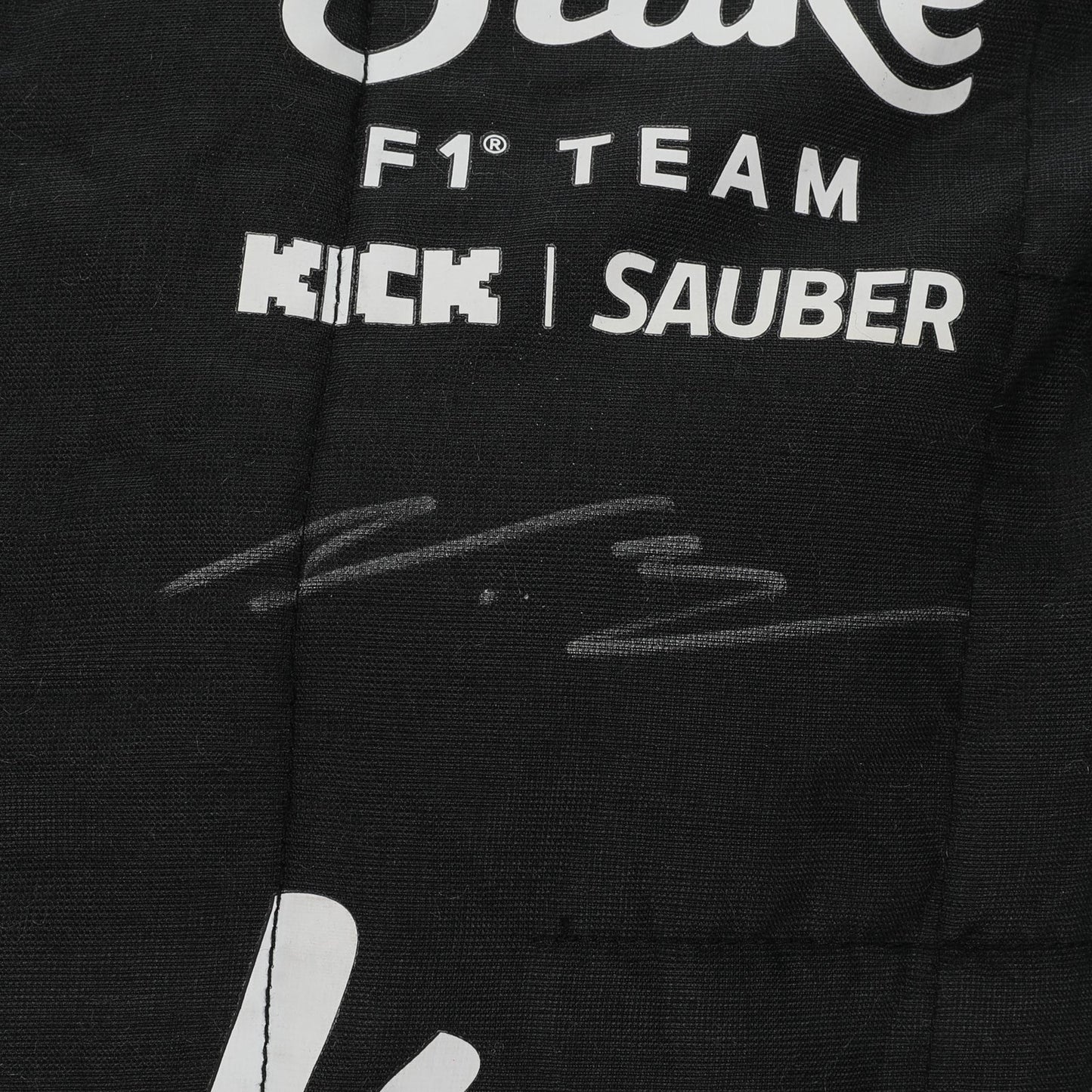  Valtteri Bottas name and Finnish flag detail on the 2024 Stake F1 race suit – Dash Racegear.