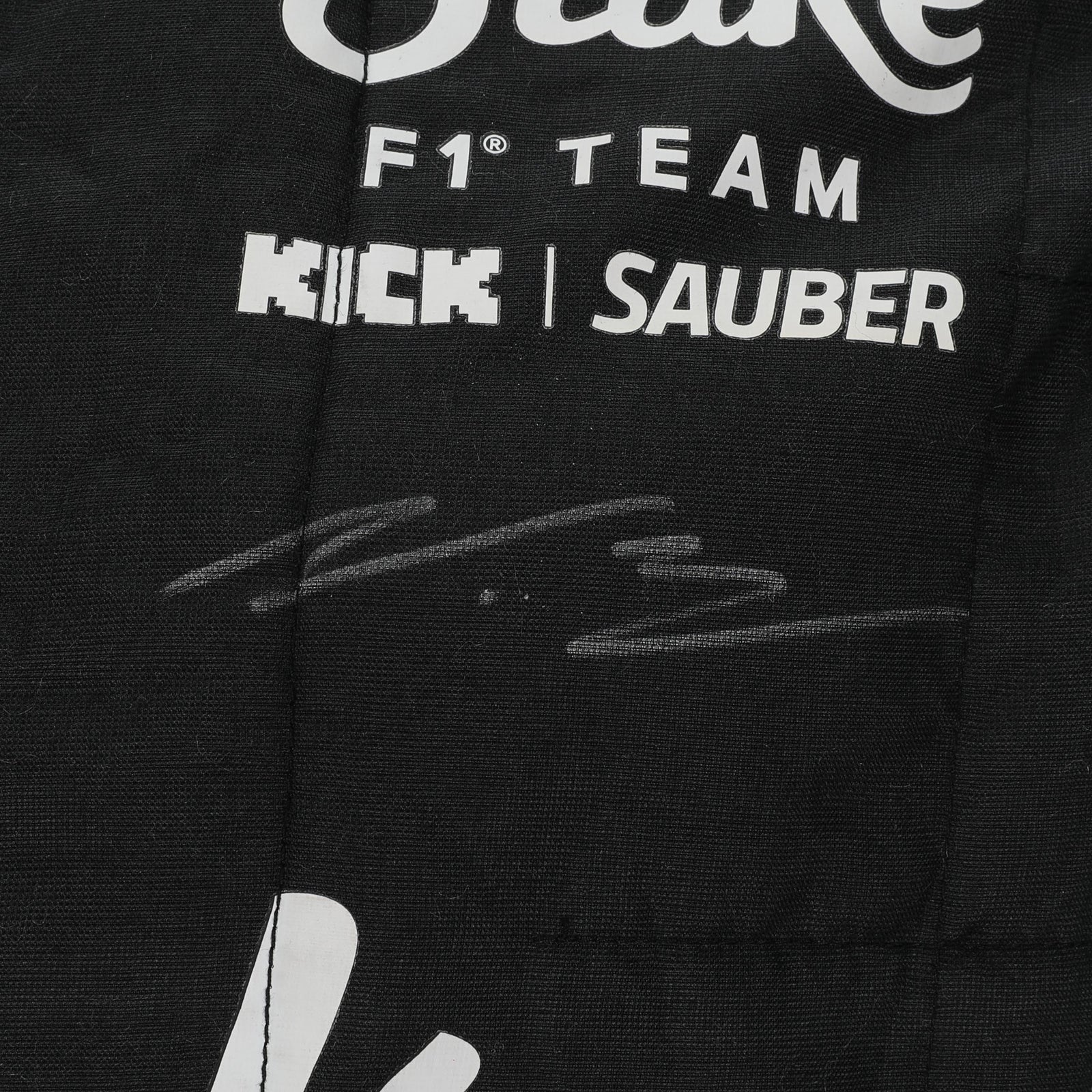  Valtteri Bottas name and Finnish flag detail on the 2024 Stake F1 race suit – Dash Racegear.